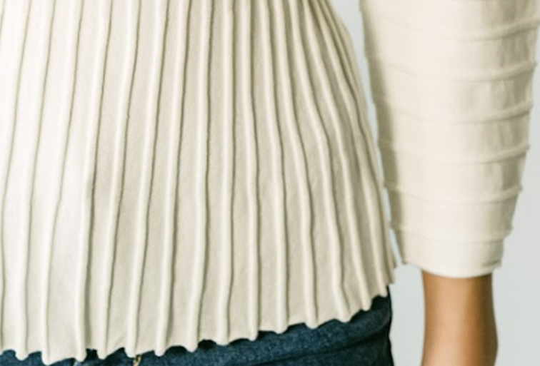 Fine-gauge knit fabric with engineered stitch pattern